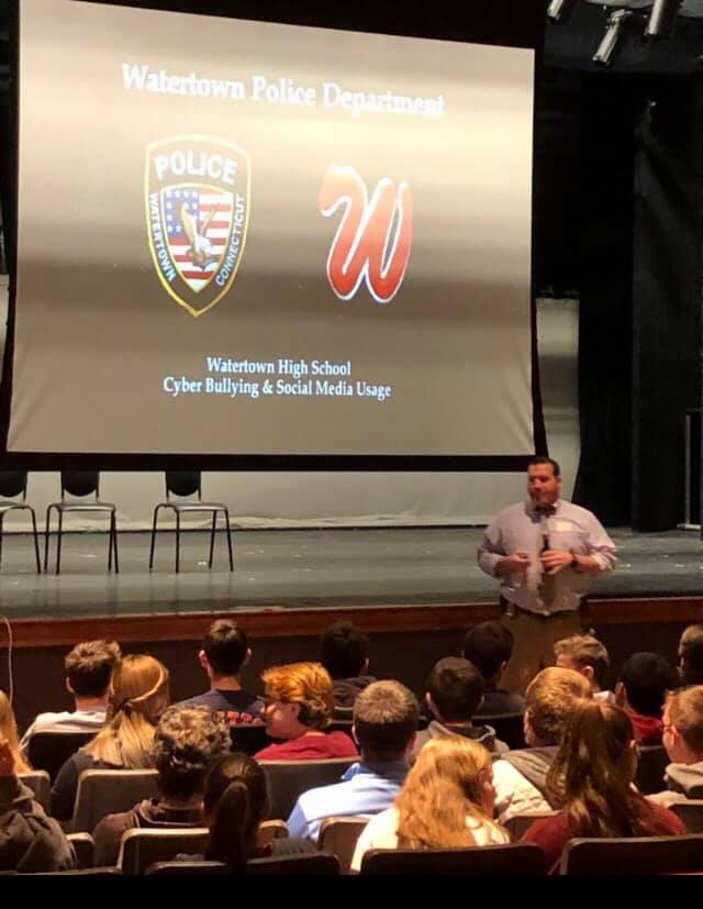WPD Detective conducting a presentation on Cyber Bullying and Social Media Usage to Watertown High School Students.